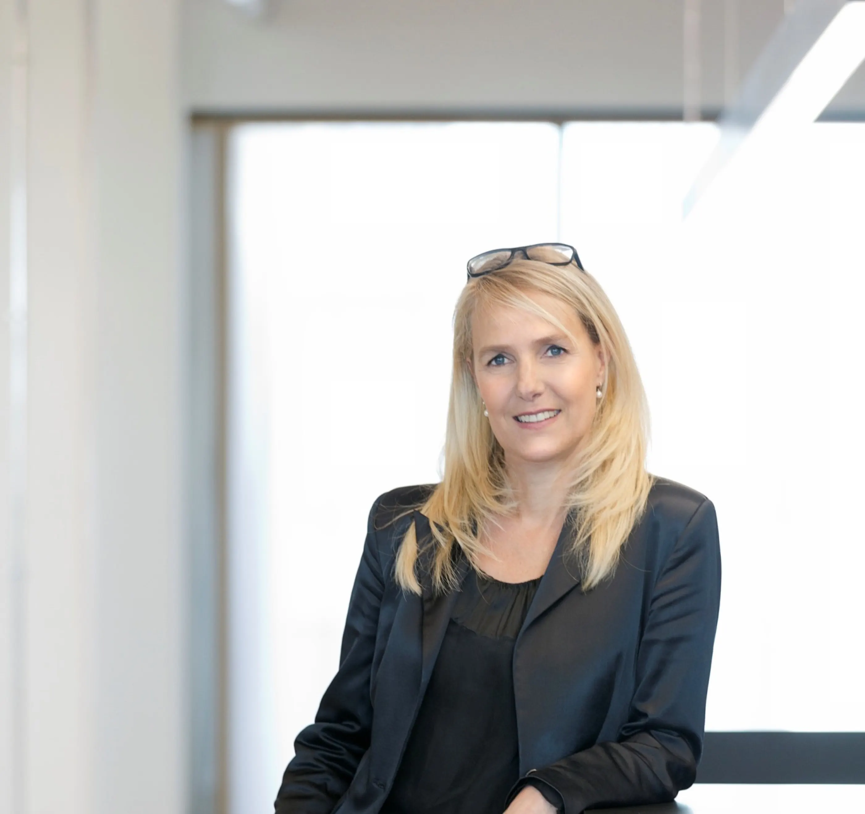 Portrait of Sabrina Stolcke in a bright office